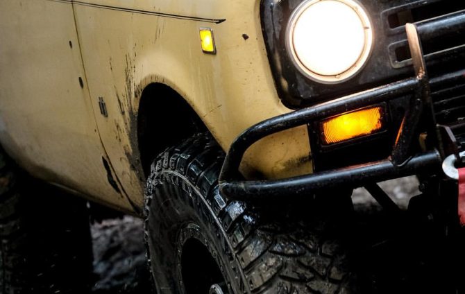 Kenda Klever tyres on off-road vehicle parked in rugged outdoor landscape